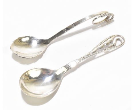 GEORG JENSEN; two sterling silver spoons to include an example with a pierced open work handle, length 15cm, approx weight 2.