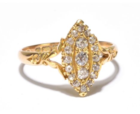 An 18ct yellow gold diamond set lozenge or boat shaped ring, set with nineteen graduated old cut diamonds in pierced scrollin