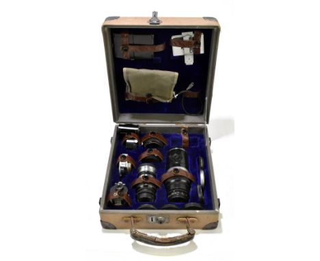 A cased set of camera lenses and equipment to include a Hektor F=13, 5cm lens, numbered 558913, Ernst Leitz Wetzlar Elmar F=9