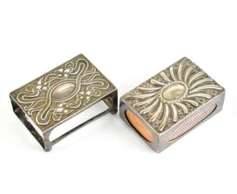 Two hallmarked silver match box sleeves, one embossed with an oval centre within a gadrooned spiral border, London 1893, leng