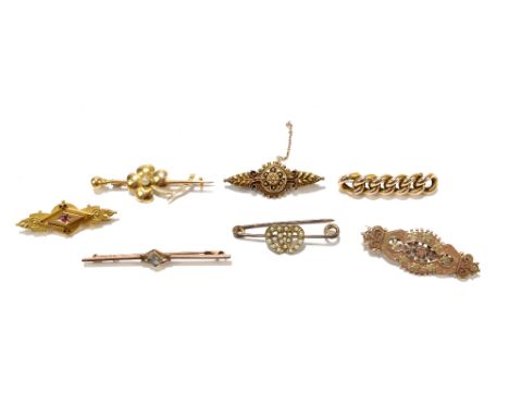 Two Victorian 15ct gold brooches, one modelled as a flower and a pin, length 4.75cm, the other in the Etruscan style, gross w