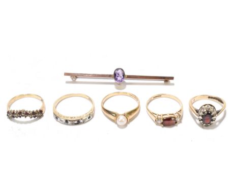 Five 9ct gold gem set rings, comprising a 21 stone diamond and ruby ring, a seven stone diamond and sapphire engraved set rin