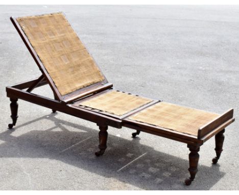 A late Victorian stained wood steamer type day bed, with label for Leveson &amp; Sons, with the three hessian lined sections 