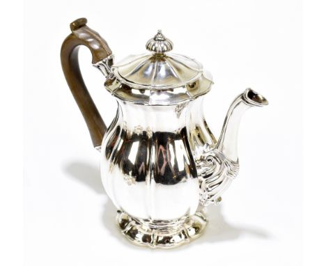WILLIAM ELEY; a George IV hallmarked silver coffee pot of baluster form with cast finial and detail to spout on spreading sha
