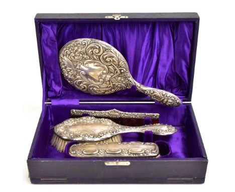 A matched variously hallmarked silver mounted dressing table set, comprising mirror bearing Green Man motifs, Boot Pure Drug 