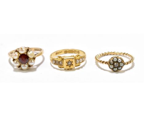 A diamond and seed pearl set 15ct gold ring, gross weight approx. 2g, with a 9ct gold garnet and pearl flower head ring, and 