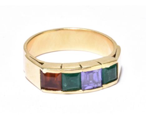 A yellow metal gem set ring with four square cut coloured stones in a channel setting, size P 1/2, approx 6.7g.Additional Inf