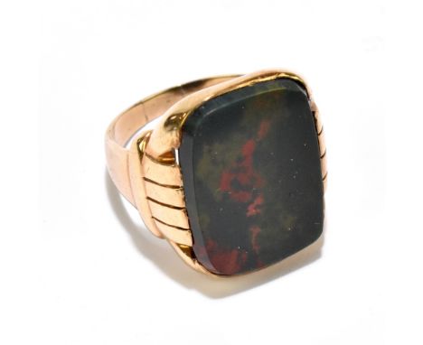 A yellow metal and large bloodstone set signet ring stamped 10k, size Q 1/2, approx 6.8g.&nbsp;Additional InformationA couple