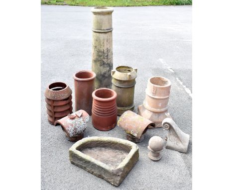 Six chimney pots, height of largest approx 120cm, a 19th century stone trough and two clay ridge tile ends (one af).Additiona