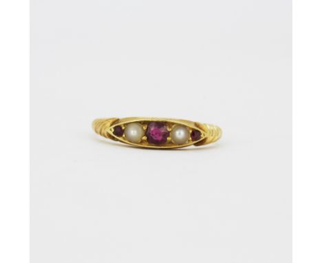A hallmarked 18ct yellow gold ruby and seed pearl ring, (N).