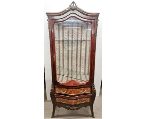 A French ormulu mounted mahogany display cabinet with burr walnut veneered drawers and sides, one glass shelf not fitting cor