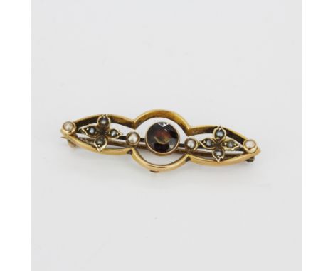 An antique hallmarked 9ct rose gold tourmaline and seed pearl set brooch, L. 2.8cm.