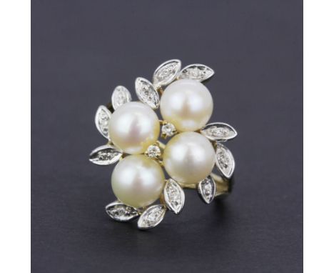 A hallmarked 9ct yellow gold pearl and diamond ring. (J.5).