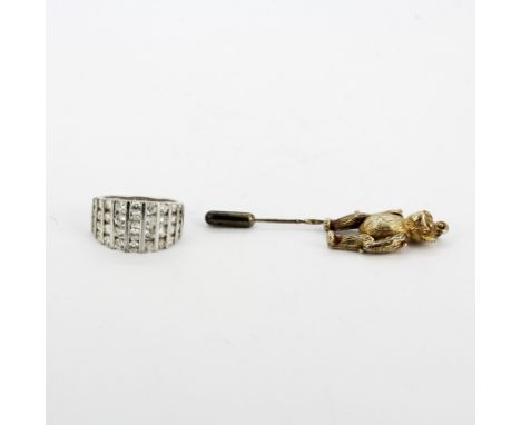 A silver stick pin with a teddy bear set with a diamond, L. 7.5cm, together with a 925 silver stone set ring, (J).