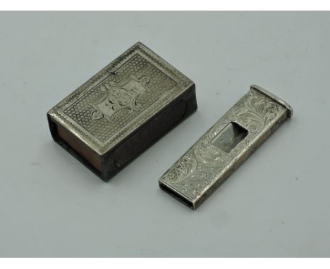 An HM silver match box case having engine turned decoration and monogrammed cartouche, and a white metal cigar cutter stamped