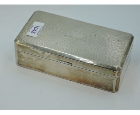 A silver cigarette box having engine turned decoration and plain cartouche, Birmingham 1955, Adie Brothers Ltd, GW approx 497