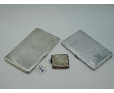 A silver cigarette case of slim rectangular form having engine turned decoration and monogram to corner, London 1939, Thomas 