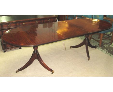 DINING TABLE, Regency design mahogany and ebony line inlaid with twin pillar and tripod support and extra leaf, 75cm H x 99cm