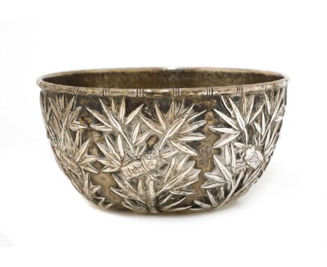 A Chinese silver bowl, late 19th/early 20th century, by Wang Hing, decorated in relief with insects and bamboo, stamped 'Wang