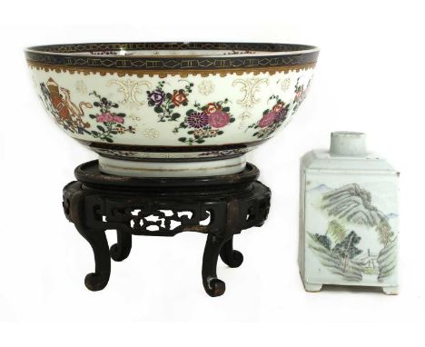 A Chinese famille rose punch bowl, late Qing dynasty, painted with a set of arms surrounded by sprigs of flowers, 28.5cm diam