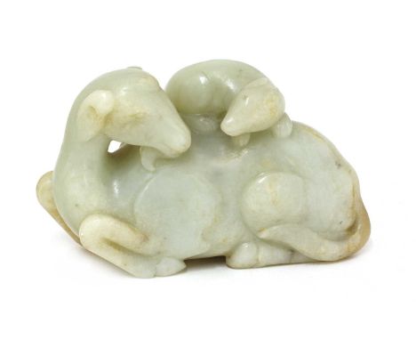 A Chinese jade carving,of a recumbent goat turning its head to the back, a mongoose clambering on its back, the stone of grey