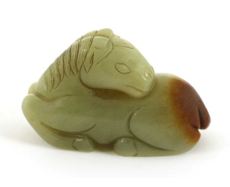 A Chinese jade carving, of a recumbent horse with its head turned to the back, 6cm longCondition report: No obvious faults.