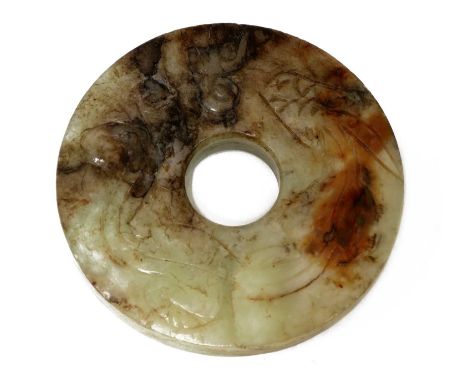 A Chinese jade bi disc, Qing dynasty (1644-1911), of circular form pierced with a central aperture, one side carved with a si