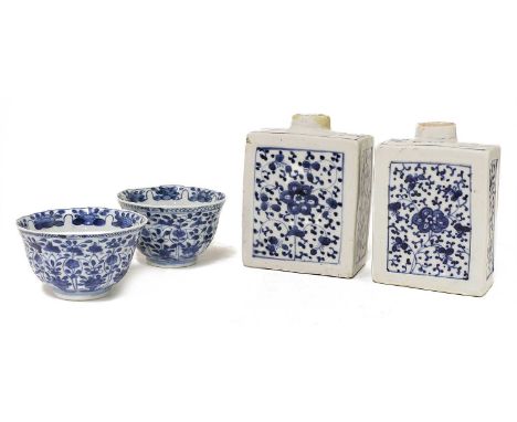 A pair of Chinese blue and white tea bowls, Kangxi (1662-1722), of lobed form rising from a circular foot, painted with folia