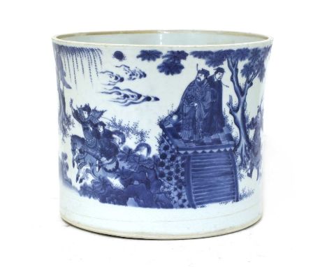 A Chinese blue and white brush pot,Chongzhen (1628-1644), of waisted cylindrical form, painted with a military contest in the