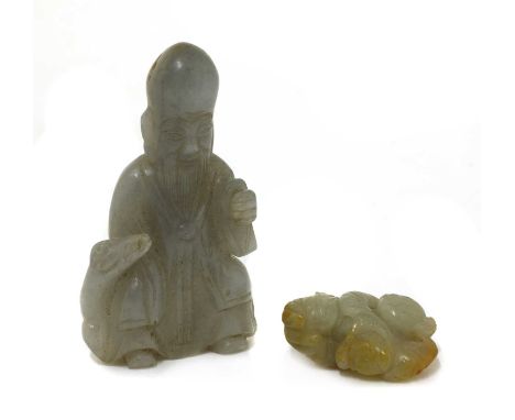 Two Chinese jade carvings,Qing dynasty (1644-1911), one Shoulao, wearing a long robe, seated on the back of a recumbent deer,