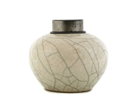 A Chinese ge-type tea caddy, Qing dynasty (1644-1911), of rounded form, covered under a crackled cream glaze, mounted with pe