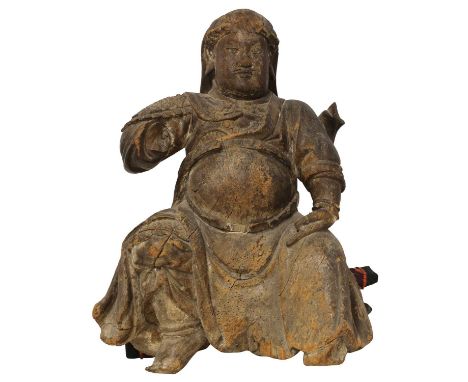 A Chinese wood figure, early 20th century, of Guan Yu, seated wearing a full armour, 56cm highProvenance: The collection of T