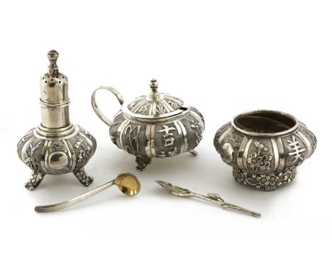 A Chinese silver salt, mustard pot and pepper shaker set,late Qing dynasty, by Wang Hing, of lobed form on floral feet, decor