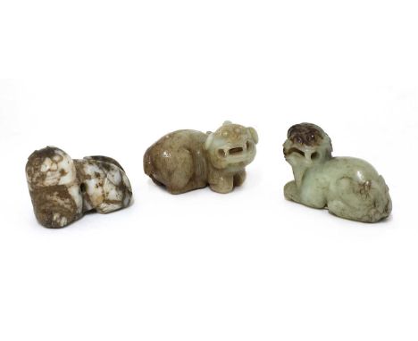 A collection of Chinese jade carvings,Ming dynasty (1368-1644), of three mythical beasts, 6.5 to 7cm long (3)Provenance: An E