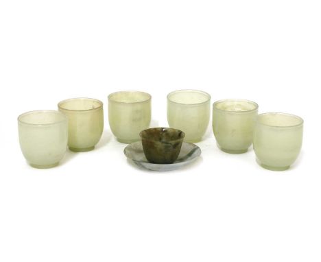 A Chinese jade cup,Qing dynasty (1644-1911), the rounded sides rising from a circular foot to a slightly flared rim, the mott