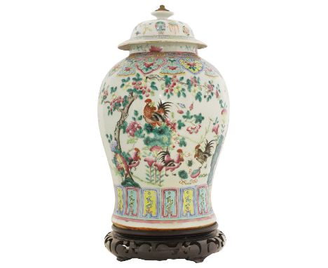 A Chinese famille rose vase and cover,19th century, of baluster form, painted with cockerels below a blossoming tree in a gar