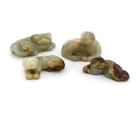 A collection of four Chinese jade carvings,19th to 20th century, comprising:a mythical beast, 6.5cm long,two dogs, 5.5 and 6.