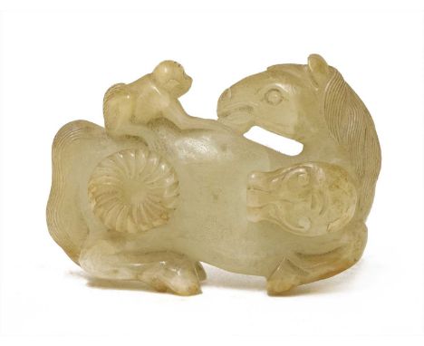 A Chinese jade belt hook,Qing dynasty (1644-1911), carved with a monkey seated on the back of a recumbent horse, the undersid