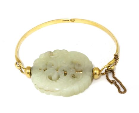 A Chinese jade and gold bangle,the jade pendant pierced and carved with a stylised chilong, the stone in greyish-white tone, 