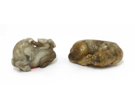 A Chinese jade carving,Qing dynasty (1644-1911), of a monkey seated on the back of a recumbent horse, the mottled stone of gr