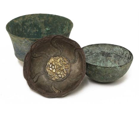 A Chinese silver bowl,each lobed petal moulded with scrolling lotus, a shaped gilded panel with sprigs of flowers to the cent