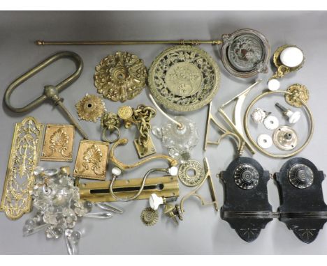 A collection of gilt brass door and window furniture, a lion's mask door knocker, finger plates, safety chair, and a pair of 