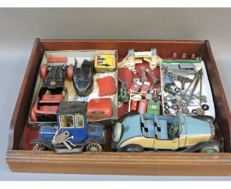 A Meccano No 1 car, Chad Valley clockwork car, Schuco Ford car, Dinky petrol pumps, signs, etc, and a Tower of London model t