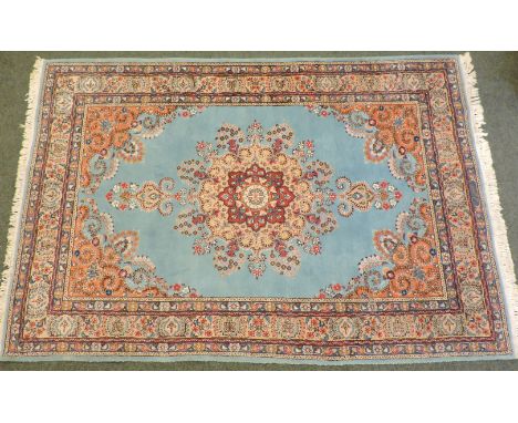 A Persian carpet, blue ground with central medallion and multiple border, 16 x 96cm