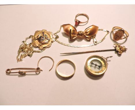 A 9ct gold coral ring, an 18ct gold wedding ring, a 9ct gold medallion, eyelet deficient, a 9ct gold compass fob, a gold cuff