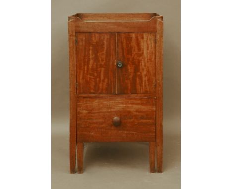 A Victorian mahogany night commode, with two doors over a pull out pail, 51cm wide