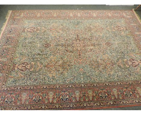 A wool carpet, central design depicting the tree of life, with multi patterned borders, possibly Persian