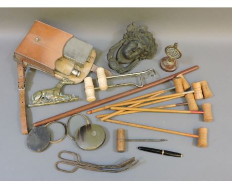 A box with table croquet mallets only, brass mask door knocker, leather saddle box with flask and box, etc