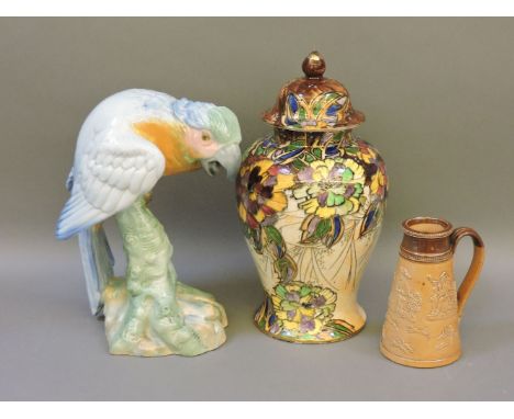 A Wade figure modelled as a large parrot, in blue and green with 1940 mark, a Royal Winton lustre glaze baluster vase with fl