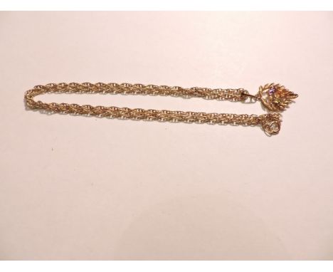 A 9ct gold peridot, citrine and amethyst pendant, on a gold Prince of Wales chain